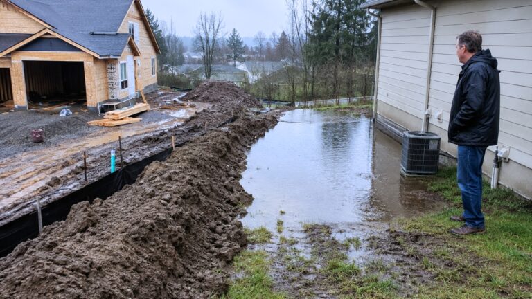Neighbor Builds a Dirt Dam on the Property Line — Then the Next Rain Could Flood the House